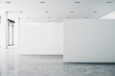 minimalistic white gallery interior with empty poster, city view and daylight. concrete floor. mock up, 3d rendering 
