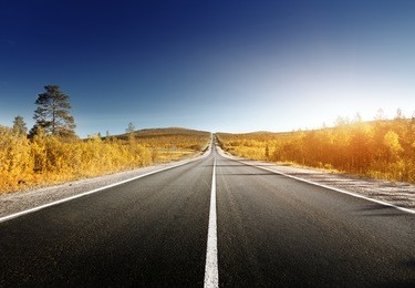 road in north mountains in autumn time 