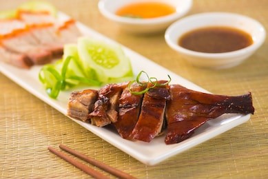 roasted duck, chinese style , drumstick and chopstick