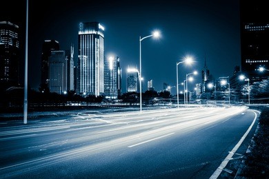 light trails on the modern city street at night