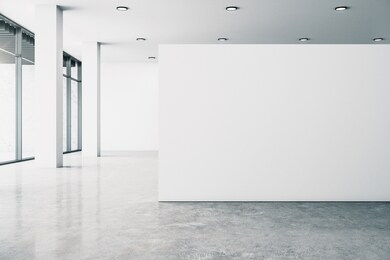 minimalistic white gallery interior with empty copyspace, city view and daylight. concrete floor. mock up, 3d rendering 