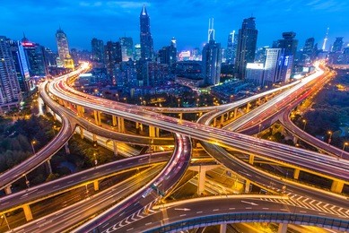 shanghai - circa april 2013 - night skyline view of city and highways with flowing traffic, circa april 2013