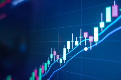 stock market graph on screen. ticker on monitor screen. investing, finance and economic concept.