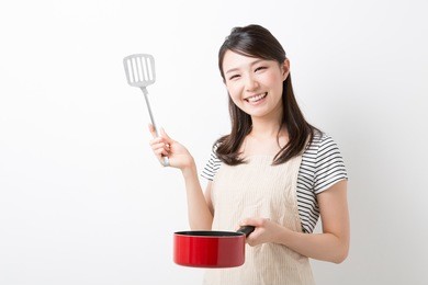 young attractive asian woman who cooks
