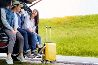 happy asian group of friends with car travel driving and suitcase at mountain road and street in vacation summer road trip on holidays to destination, traveler transportation vehicle people lifestyle 