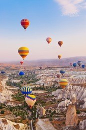 hot air balloon flying over rock landscape at cappadocia turkey