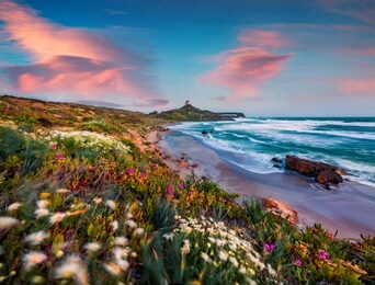 windy spring scene of sardinia, italy, europe. attractive morning view of capo san marco lighthouse on del sinis peninsula. spectacular seascape of mediterranean sea. traveling concept background.