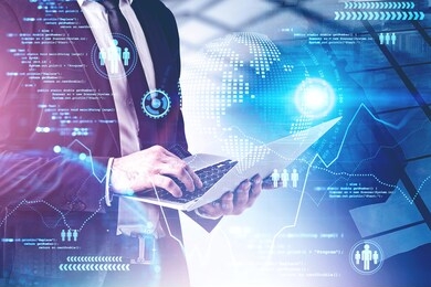 unrecognizable young businessman using laptop in city with double exposure of big data interface. toned image