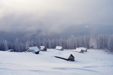 winter landscape with snow-covered mountain villages. carpathians, ukraine