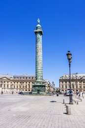 vendome column with statue of napoleon bonaparte, on the place vendome, in france. vendome column has 425 spiraling bas-relief bronze plates were made out of cannon.