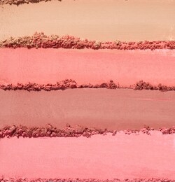 close up of face powder on white background