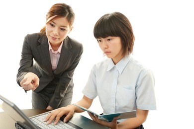 teacher with girl studying.