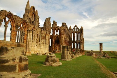 whitby abbey is a ruined benedictine abbey overlooking the north sea on the east cliff above whitby in north yorkshire, england