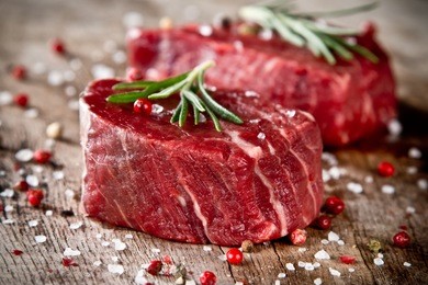 fresh raw beef steak on wood