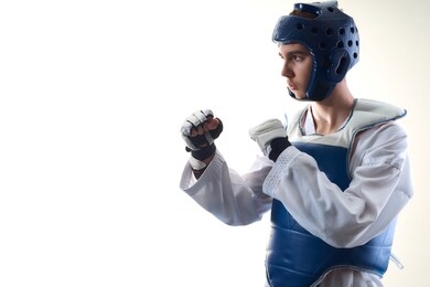photo of taekwondo athlete taken in studio with white background.