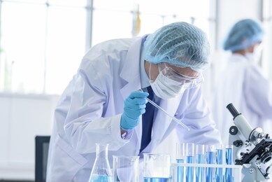 asian scientist team has researching in laboratory.