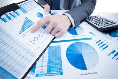 man hand with pen and business report