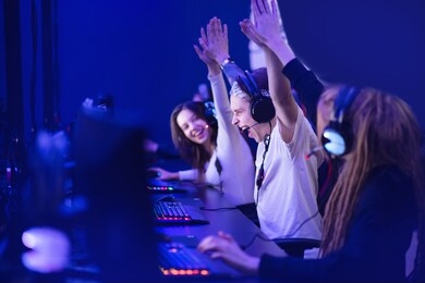 team professional gamer playing winning tournaments online games computer.