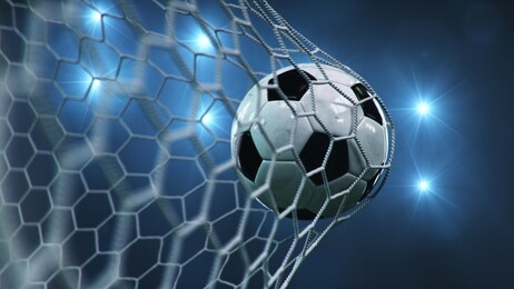 soccer ball flew into the goal. soccer ball bends the net, against the background of flashes of light. soccer ball in goal net on blue background. a moment of delight. 3d illustration