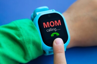 wearable kids smart watch calls mom and location tracking with touch screen and voice service, blue electronic gadget with rubber wristband for children