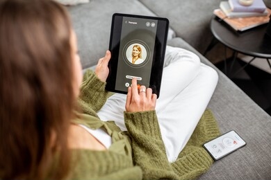woman making video call to a doctor using digital tablet, feeling bad at home. concept of telemedicine and patient counseling online