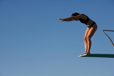 a woman diving into a pool