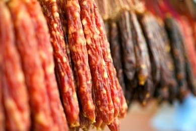 many chinese sausage hanging on street market in hong kong