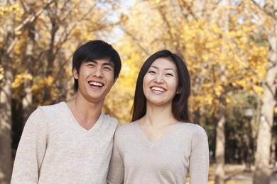 young couple in the park in autumn