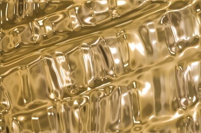metallic gold wavy background.
gold foil texture, gold metallic shiny texture.
