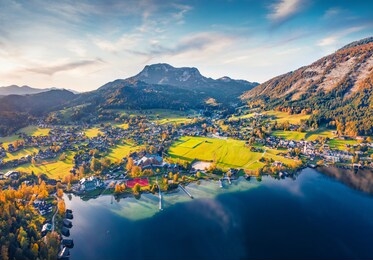 view from flying drone. awesome autumn scene of altausseer lake. evening landscape of austrian alps. breathtaking autumn view of altaussee village. traveling concept background.