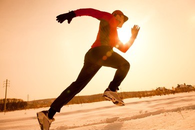 athletic  man running in winter morning