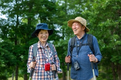 senior couple walking in the mountains