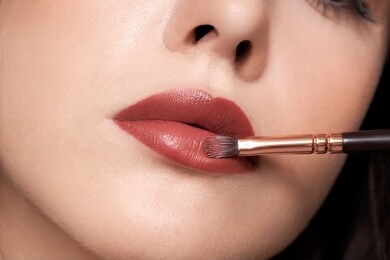 perfect red lips makeup. close up macro photo with a beautiful female mouth. full lips full. large detail of the face. perfect clear skin, light fresh lip makeup