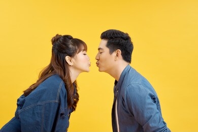 profile side photo of charming spouses send air kiss isolated over vivid color background