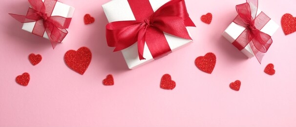 valentine's day background with white gift boxes decorated red ribbon bow and red hearts. valentines day concept.