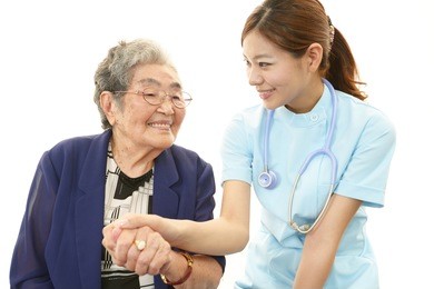 smiling asian medical doctor and senior woman
