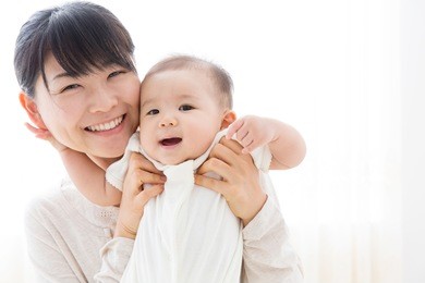 young asian mother and baby in the room