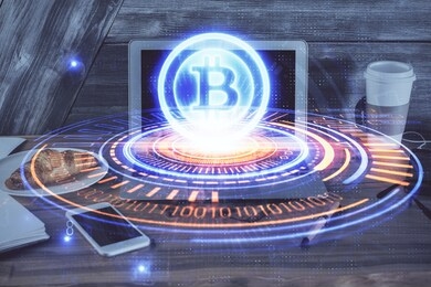 double exposure of blockchain theme hologram and table with computer background. concept of bitcoin crypto currency.