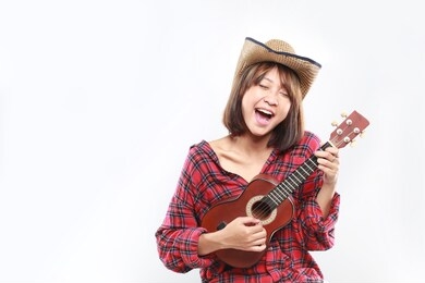 asian girl play guitar isolated. asian woman with music instruments