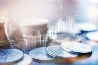 finance and business backgrounds concept. double exposure of stock market report, financial graph and row of coins with copy space