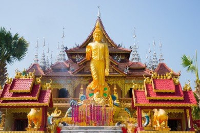 figure of buddha and buddhist palace in xishuangbanna,china
