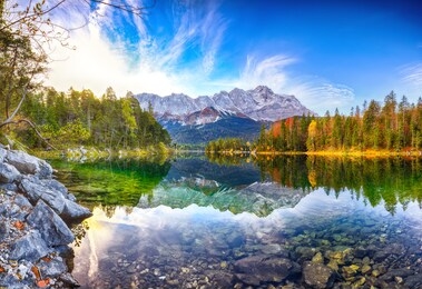 faboulus autumn landscape of eibsee lake in front of zugspitze summit under sunlight.location: eibsee lake, garmisch-partenkirchen, bavarian alps, germany, europe