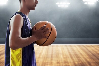 basketball player holding a ball