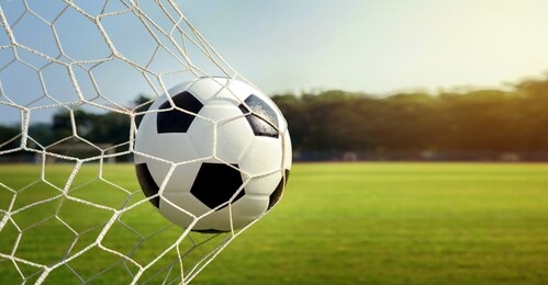 soccer ball in goal.football in the sunset.success concept.