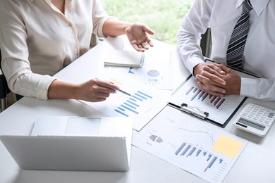 group of business leader team conference on meeting presentation to planning investment project working and strategy of business making conversation with partner, financial and accounting concept.