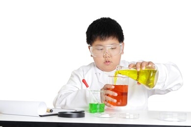 elementary school boys wear white clothes, doing science experiments in the laboratory. concept of child education development. isolated