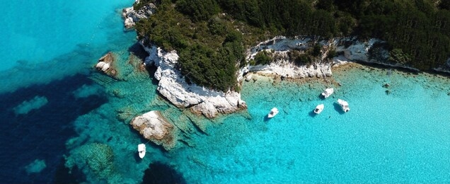 aerial drone ultra wide photo of paradise tropical exotic white rocky deep turquoise seascape forming a blue lagoon in caribbean popular destination