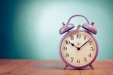 retro clock on table front gradient mint green background