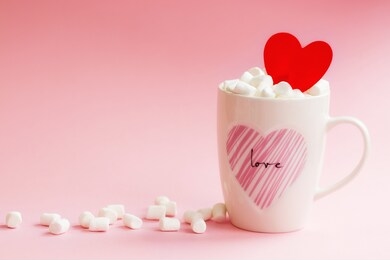mug with candy and marshmallow hearts on pink background. romantic, st valentines day concept, greeting card. seasonal winter february holiday, woman, mother day.