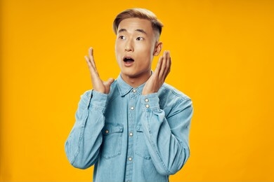 surprised face young man blue shirt